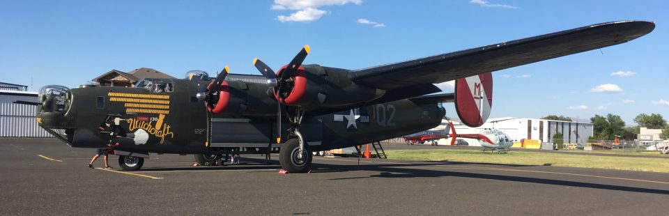 Yakima Air Terminal, a B-24 visits the airport. An old B-24 prop aircraft with Witchcraft and a witch on the side.