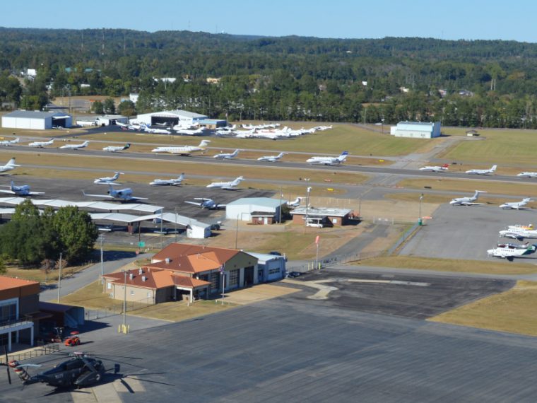 The Tuscaloosa Regional Airport aerial view with lots of airplanes on display on the runway.