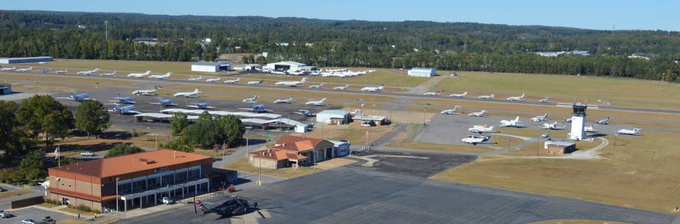 The Tuscaloosa Regional Airport aerial view with lots of airplanes on display on the runway.