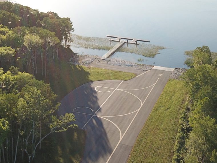 Leesburg International Airport aerial view of their new seaplane dock along the water.