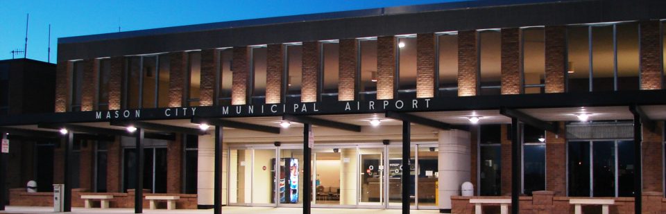 Mason City Municipal Airport MCW terminal building at night.